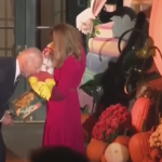 Biden Sees Baby In A Chicken Costume For Halloween, So Of Course He Pretends To Bite Him