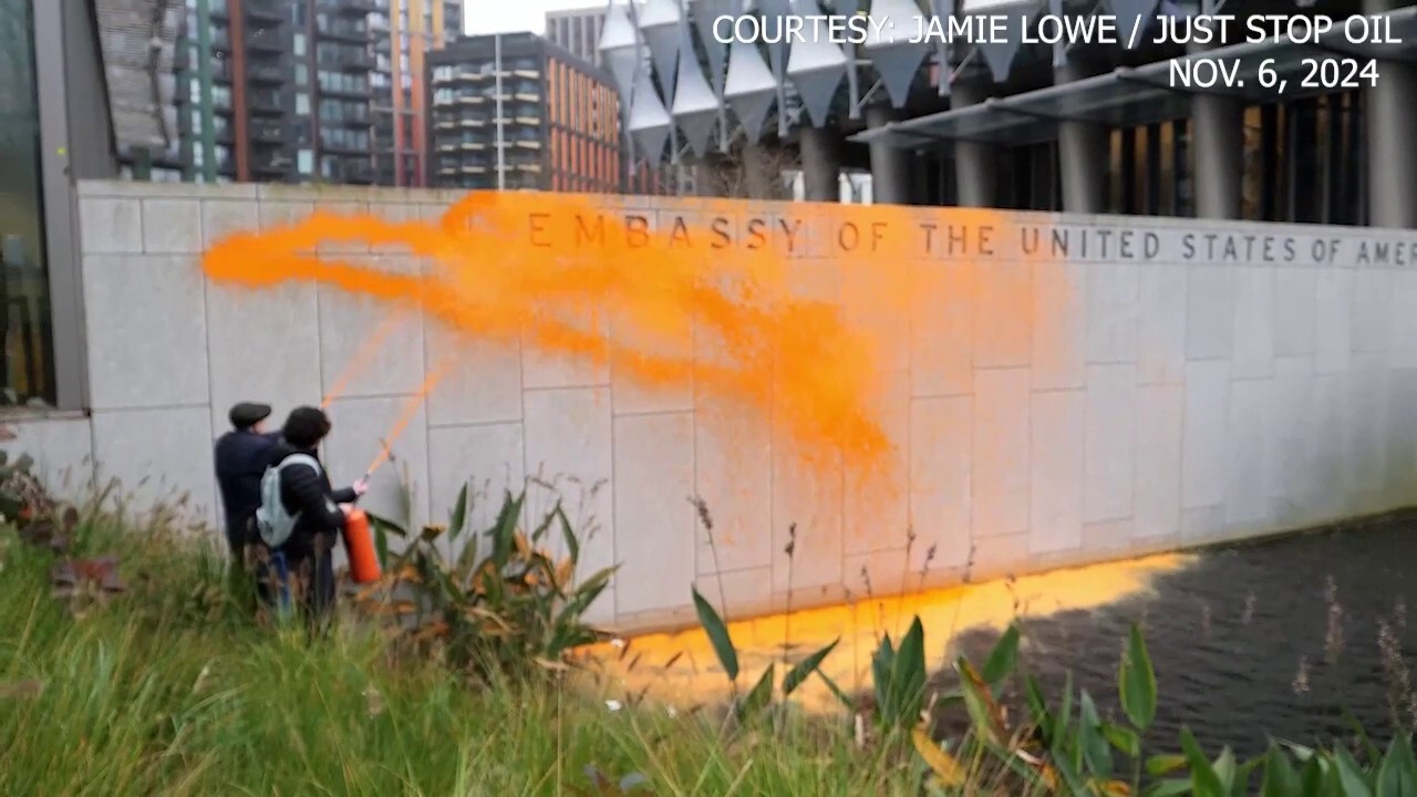 Climate activists protest Trump win, spray orange paint on US embassy in London