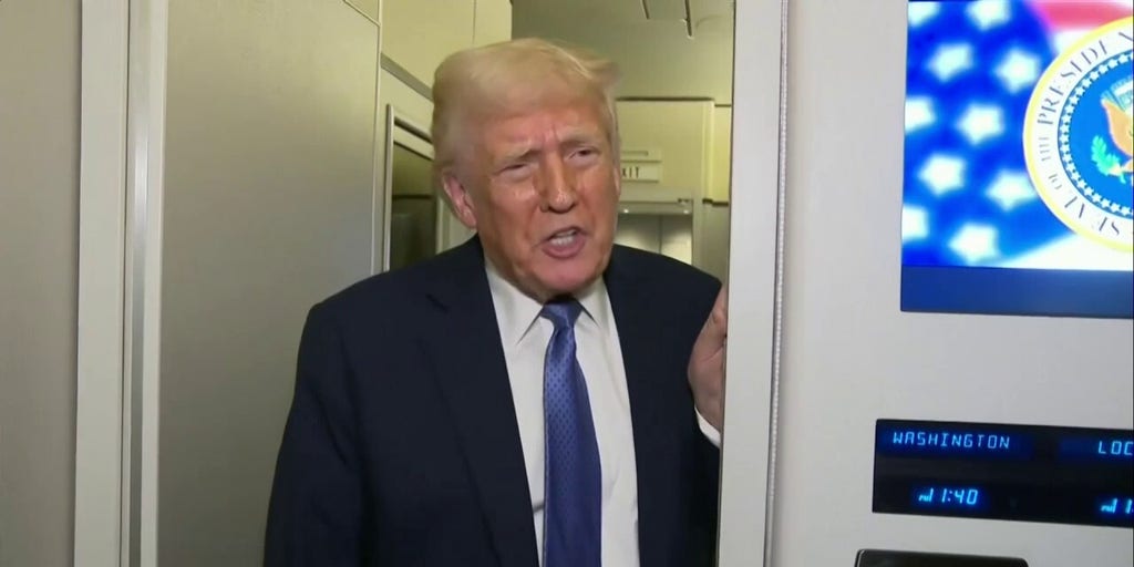 President Donald Trump speaks with reporters on Air Force One